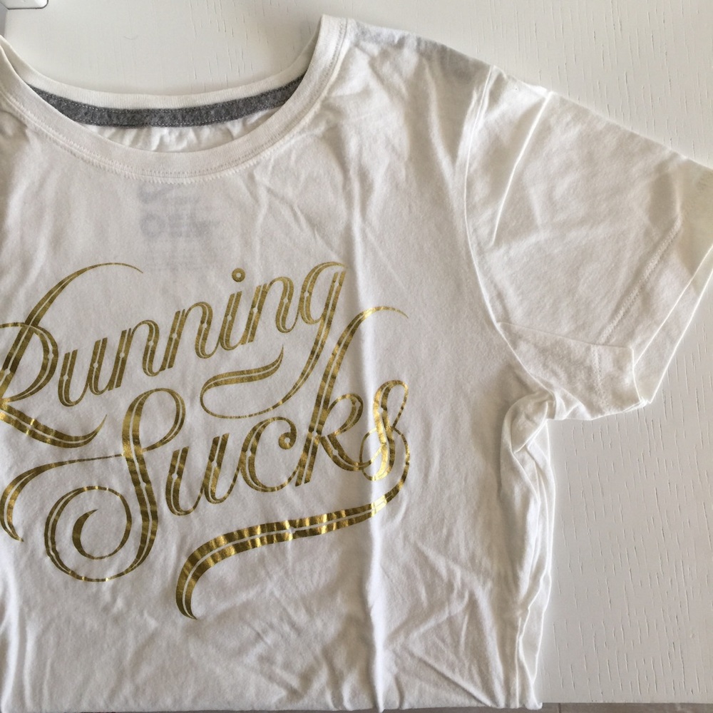 Nike | "running sucks" ivory tee with gold graphic